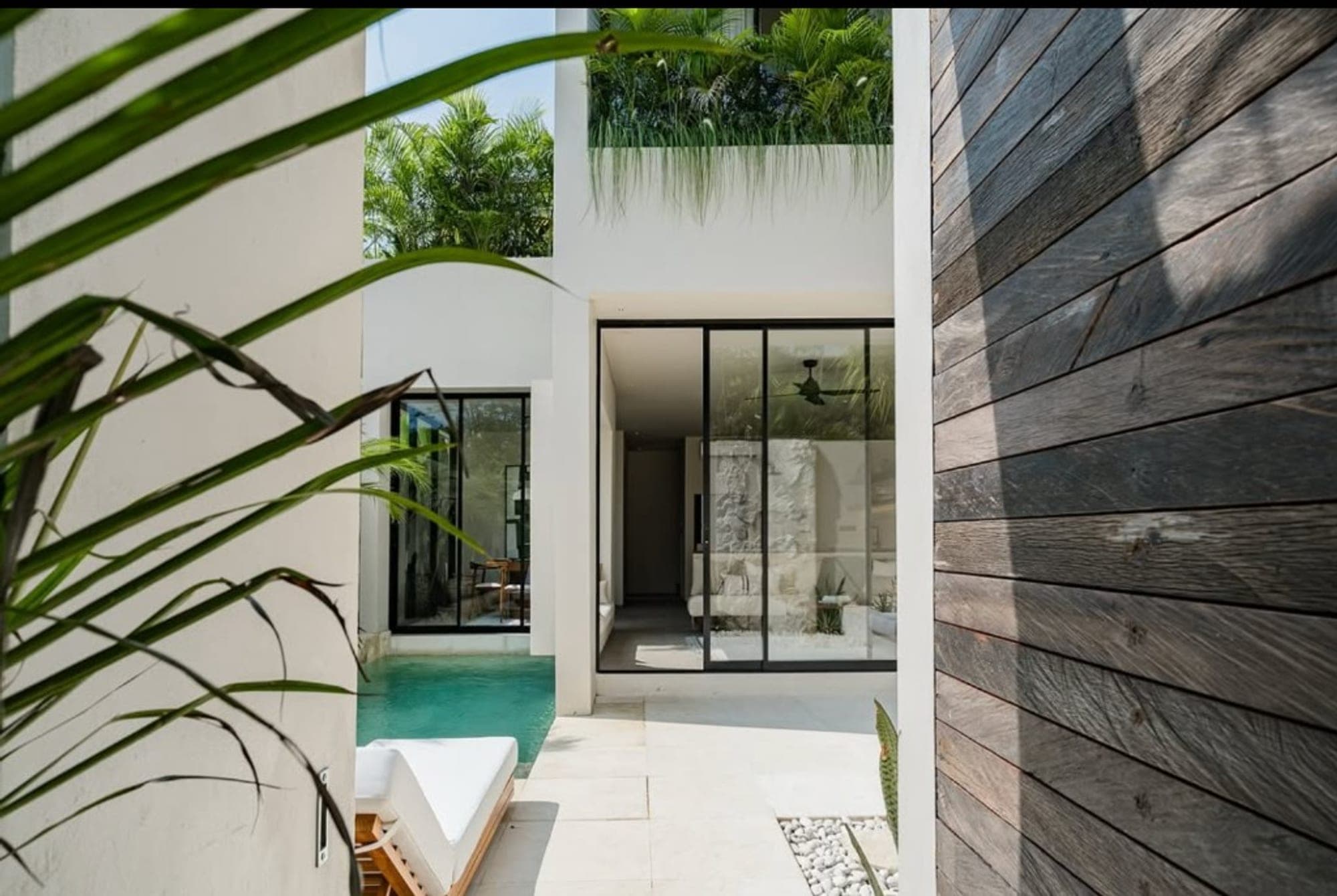 Modern white villa with private plunge pool and tropical courtyard in Bali