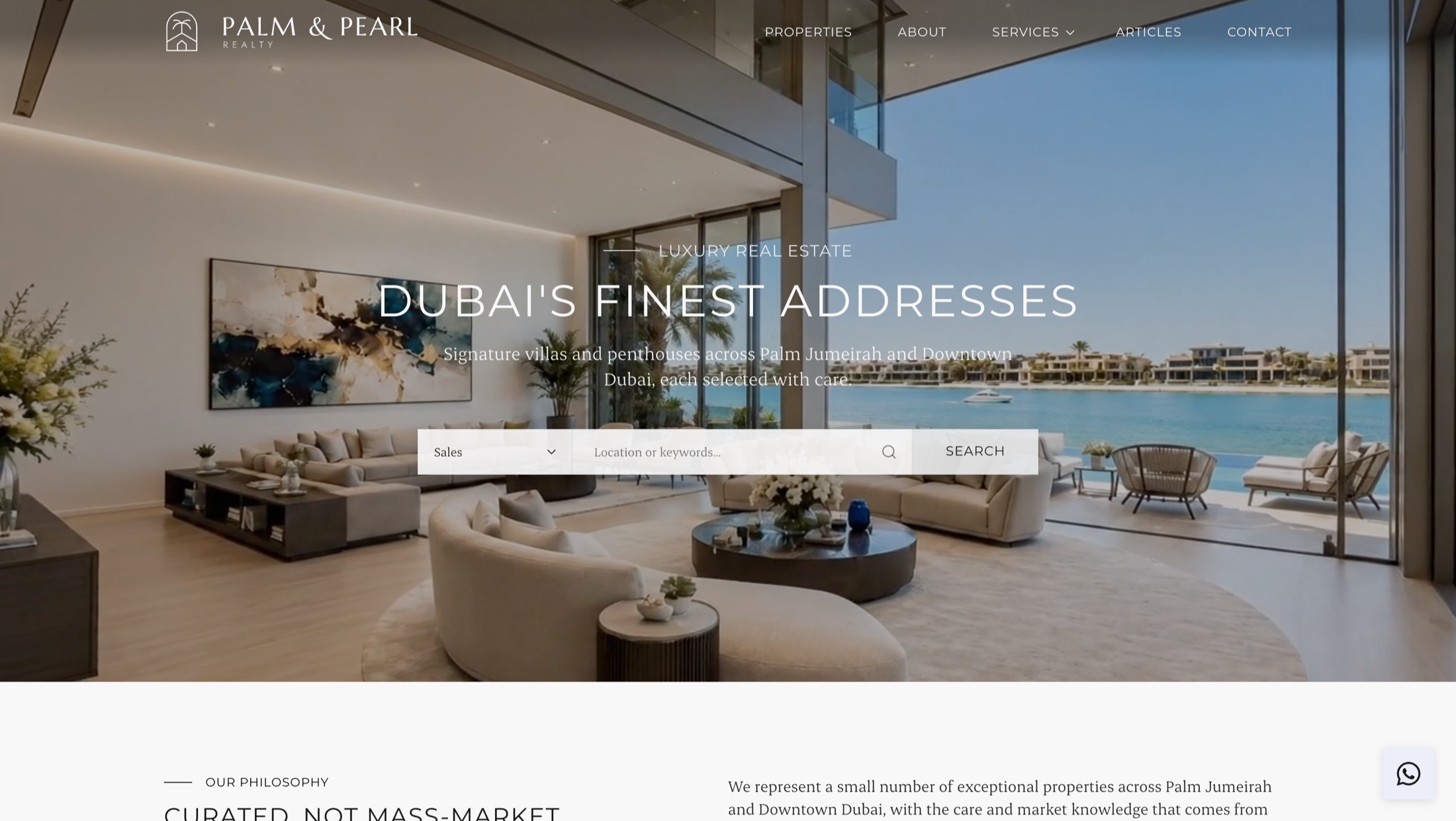 The Palm and Pearl Realty homepage, a full-bleed Dubai penthouse interior with a centred headline